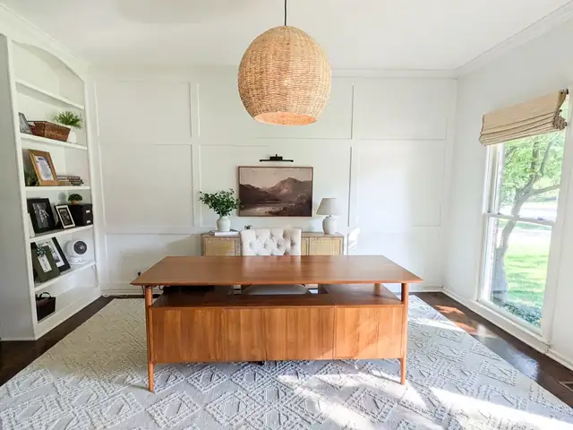 Home office remodel in Lee's Summit with built-in bookshelves, board-and-batten wall, walnut desk and woven pendant light