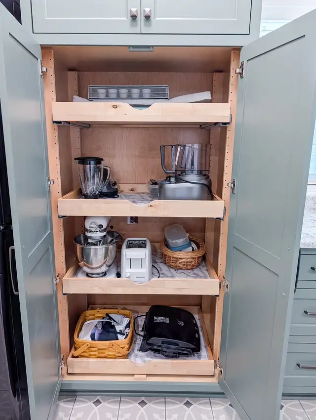 Appliance garage in a Lee's Summit kitchen remodel with pull-out shelves that hide small appliances